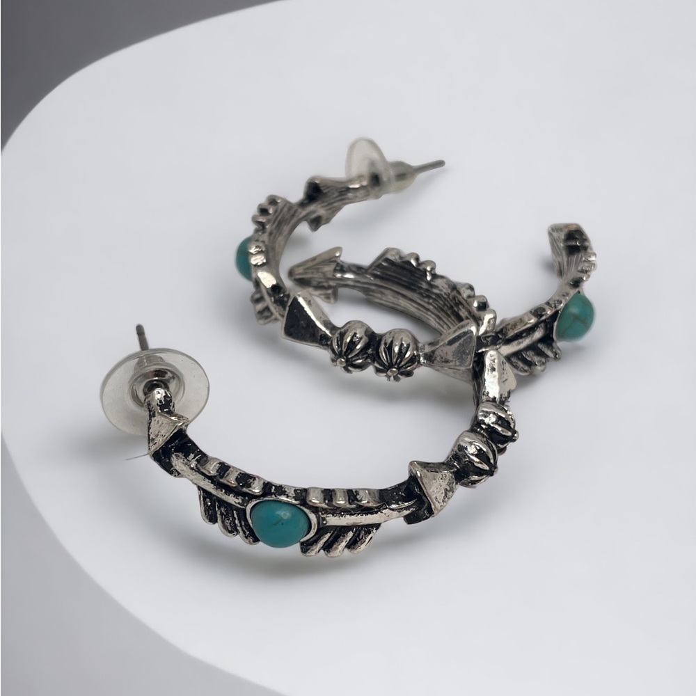 Western style etched hoop earrings with howlite turquoise accents, silver tone